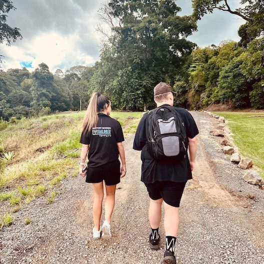 Man and Woman Walking at the Park — NDIS Provider on the Sunshine Coast, QLD